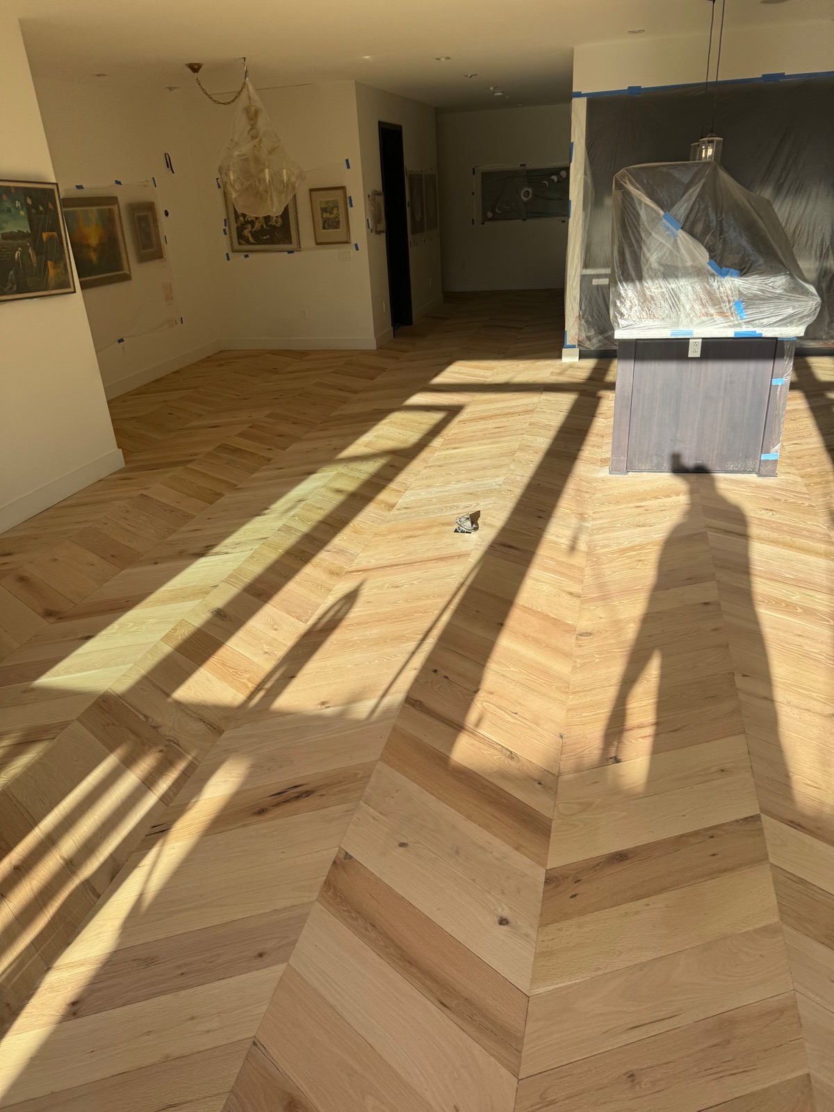 Sunlit reclaimed red oak chevron floor sealed with a natural finish