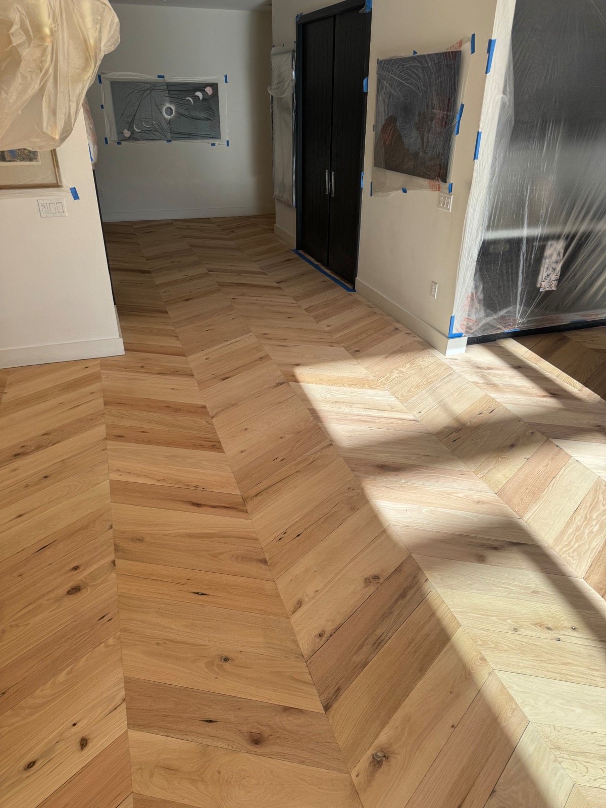 Chevron pattern detail of the sealed reclaimed red oak floor